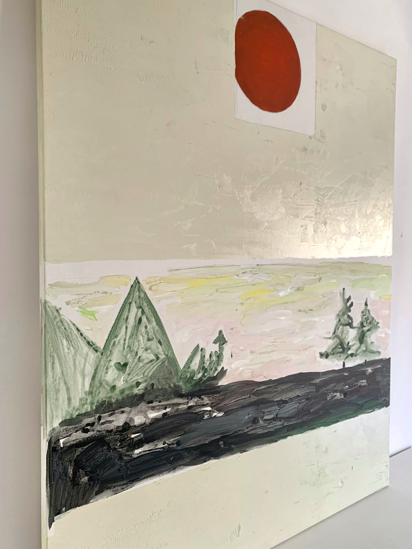 White painting with red circle